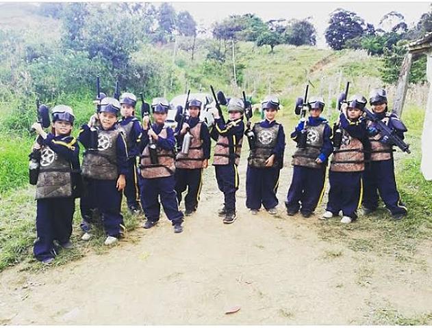 Celebrating the birthday of a friend playing paintball