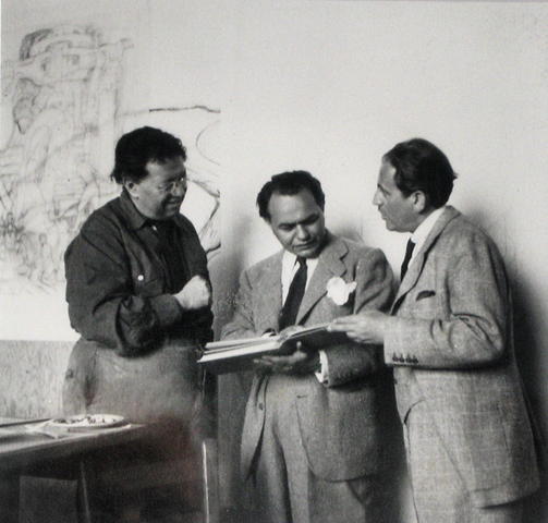 Rivera, Edward G. Robinson, and art dealer Sam Salz visit in Rivera's studio behind the mural in June 1940.