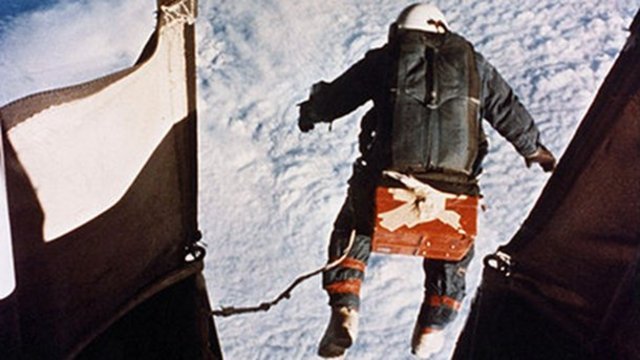 Joseph Kittinger parachutes from a balloon over the State of New Mexico at 102,800 feet (31,333 m). Kittinger set unbeaten (as of 2005) world records for: high-altitude jump; free-fall by falling 16 miles (25.7 km) before opening his parachute; and also t