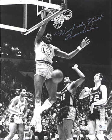 The professional basketball player Wilt Chamberlain of the Philadelphia 76ers gets 55 rebounds in an NBA game versus the Boston Celtics.