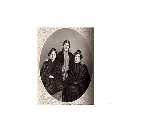 Sra. Margaret Fox, y sus hijas Maggiey Kate escuchan golpes en la casa (Inicio del Espiritualismo Moderno) en Hydesville