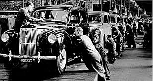 Ford installs first moving assembly line