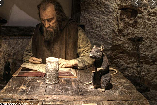 Marco Polo is held prisoner and writes his book