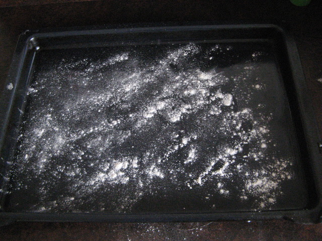 Flour and place scones onto a tray.