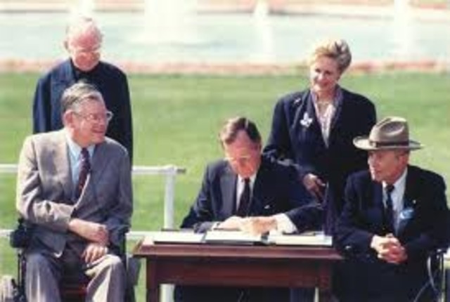 President Bush signs Americans With Disabilities Act into Law