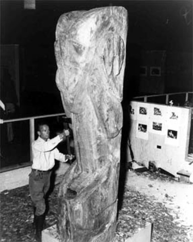 Dudley Carter carves the "Bighorn Mountain Ram" from redwood.