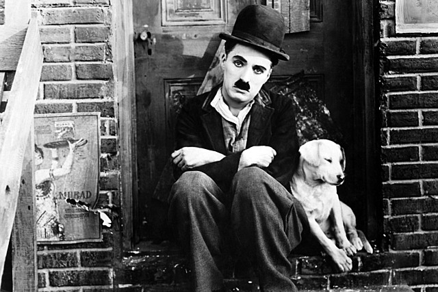 Charlie Chaplin signs with First National