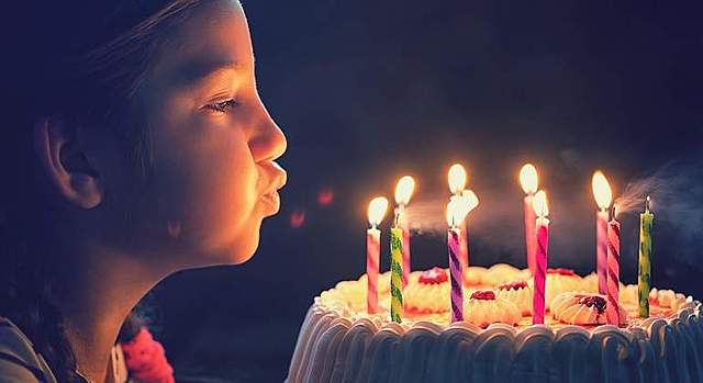 She is going to blow the candles.