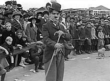 Charlie Chaplin debuts as "The Tramp"