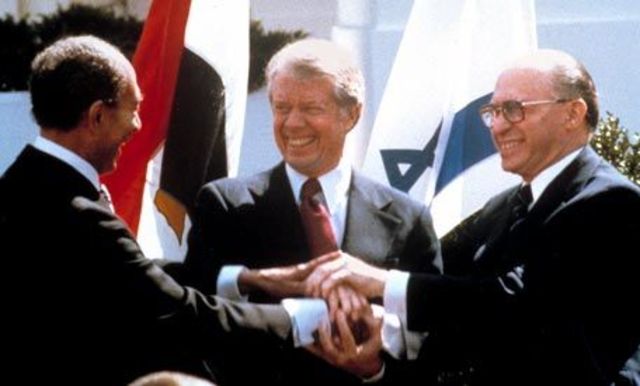 President Jimmy Carter mediates Egyptian-Israeli peace settlement