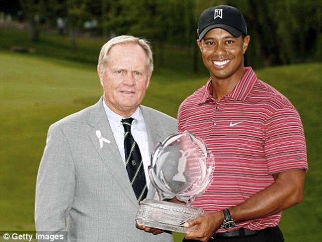 Tiger Woods becomes the first golfer to hold all four major golf titles