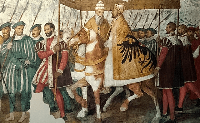 Carlos I es coronado emperador y rey de Italia en Bolonia por el Papa Clemente VII