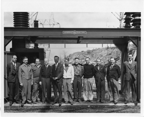 General Electric employees pose for photo following a test of Dam circuit breakers