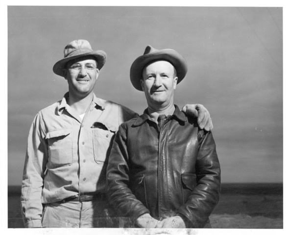 Howard A. Hales and A.L. Hales pose for photo on adjoining farms on Columbia Irrigation Project lands