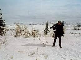 Chris McCandless, under the name Alex, is hitchhiking an an Alaskan road and is picked up by Jim Gallien.