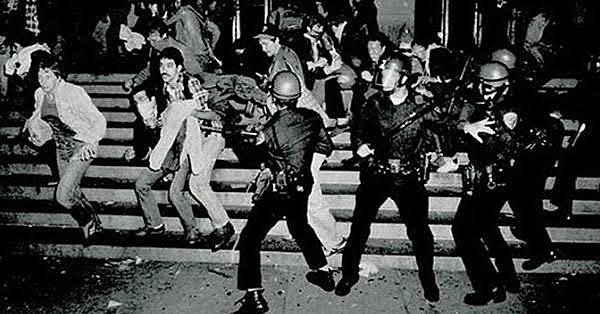 Stonewall crowd erupts after police arrest and rough up patrons.