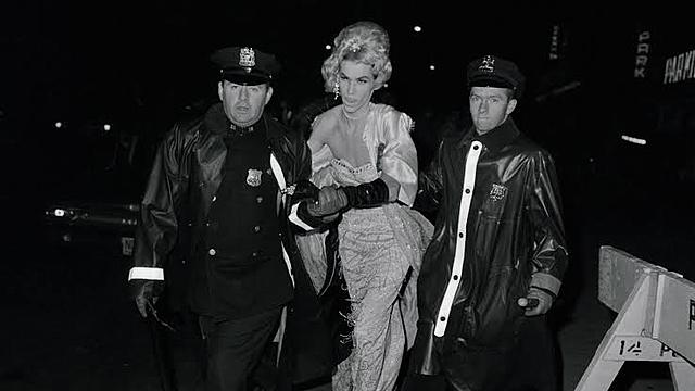 Police retreat and barricade themselves inside Stonewall.