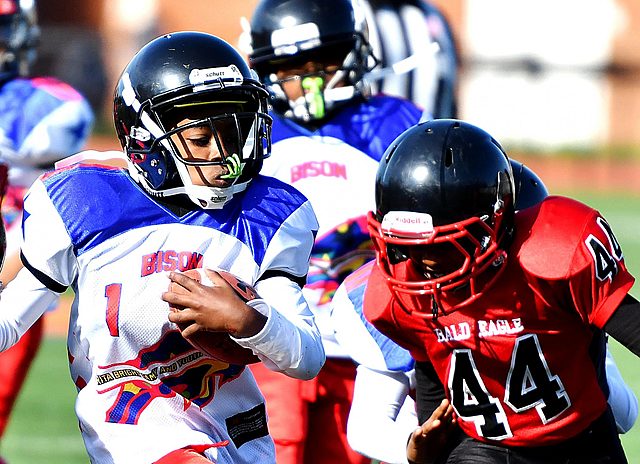 Playing football as a kid.