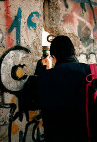 Berlin Wall falls.