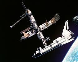 For the first time, the Space Shuttle Atlantis docks with the Russian space station Mir.