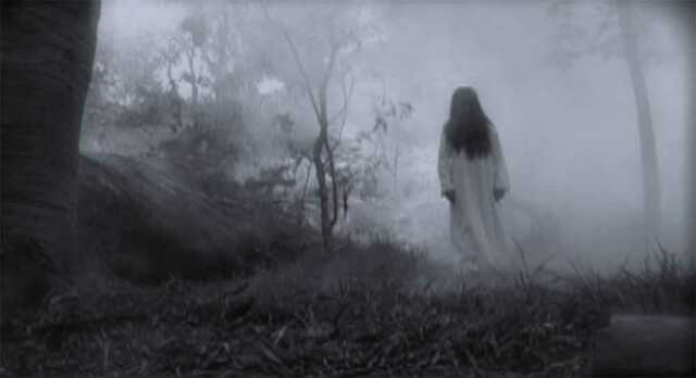 She appears as a ghost dressed in white