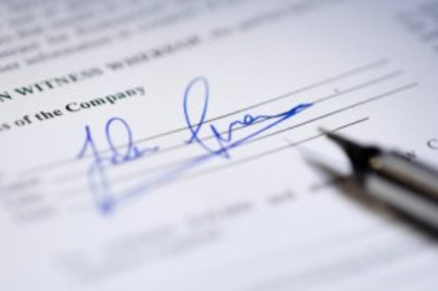 Christopher Columbus signs contract.