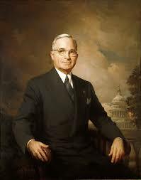 He signs the Truman Doctrine