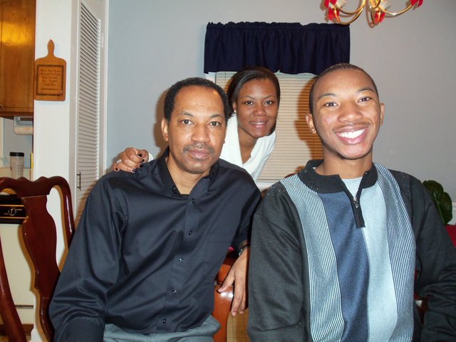 This is a picture of me with my sister and dad on the Christmas of 2010. My favorite part of this day was watching snow cover the ground.