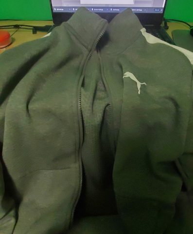 My mom bought me a black zip up sweater with no hood