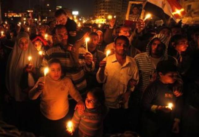 Protestors set a symbolic memorial of the victims, which an unofficial count put at 300; entrances to Parliament are sealed off.