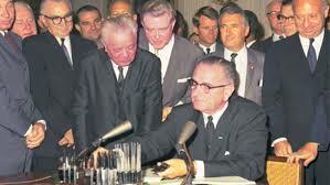 The Civil Rights Act of 1964 signed by President Johnson