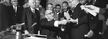 The Civil Rights Act of 1964 signed by President Johnson