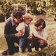 300px young boy, mother and grandfather in a garden   1984 05