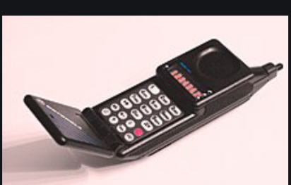 First flip cell phone invented