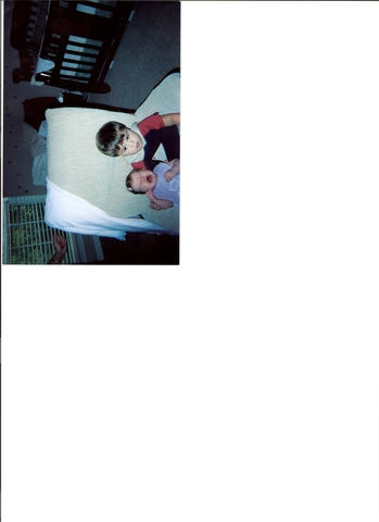 First time holding his baby sister