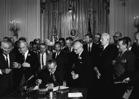 The Civil Rights Act of 1964 signed by President Johnson