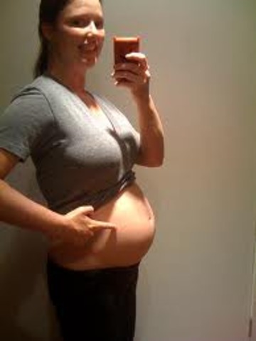 six months pregnant