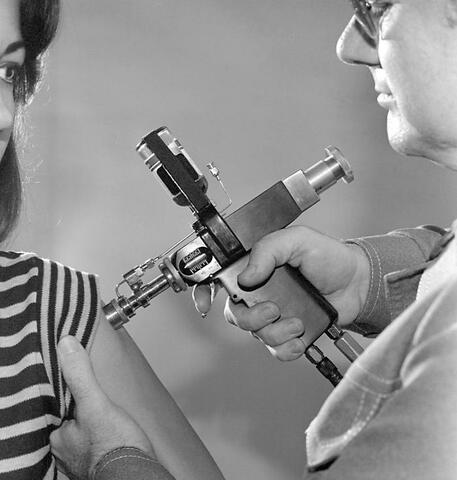 Vaccination of women by person in a lab coat