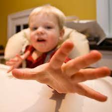 baby motions for what they want instead of crying