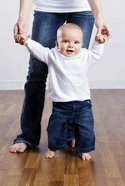 starts walking with help