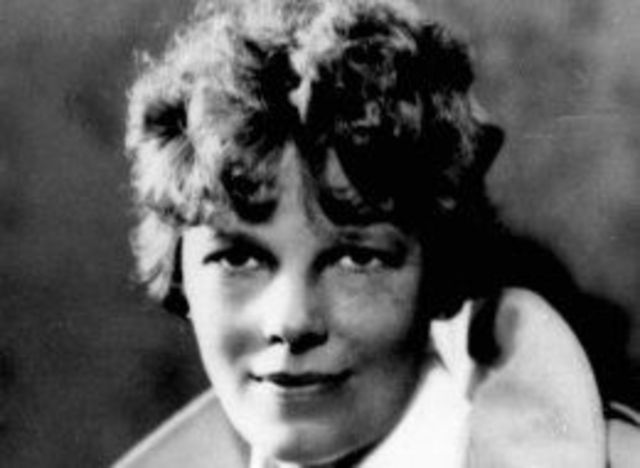 Woman Flies over Ocean