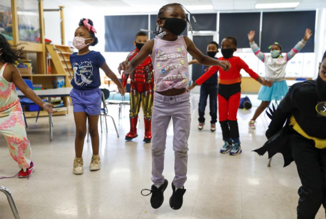 kids learning with masks and social distancing