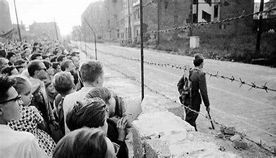 Berlin Wall built to prevent people from leaving communist East Berlin