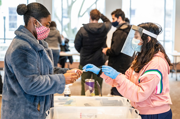 UW-Madison students arrive back on campus with spring testing requirement of twice-a-week testing to enter buildings