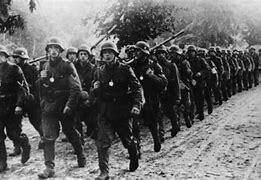 Germany violates the Treaty of Versailles