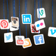 Social media icons hanging from blue string