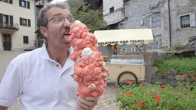 Most ice cream scoops balanced on a cone