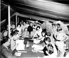 Representatives of warring nations sign armistice.