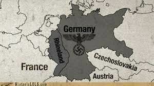 Germany violates the Treaty of Versailles by reoccupying the Rhineland
