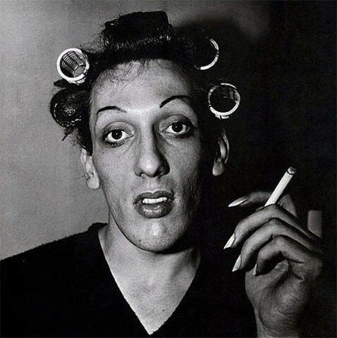 Diane Arbus, “A young man with curlers at home on West 20th Street”